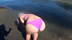 Lesbos rest and pummel on the sea bank. Gf with a wooly cooter in a bikini doggie-style wiggles a massive butt. Point of view Outdoors.
