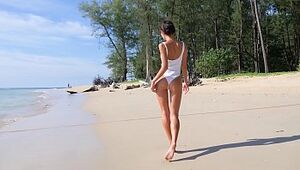 Uber-sexy teenage on a beach taunting with her donk in one lump bathing suit
